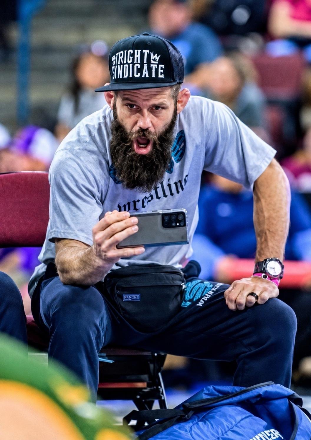 Jason Lowe speaking with athletes during practice