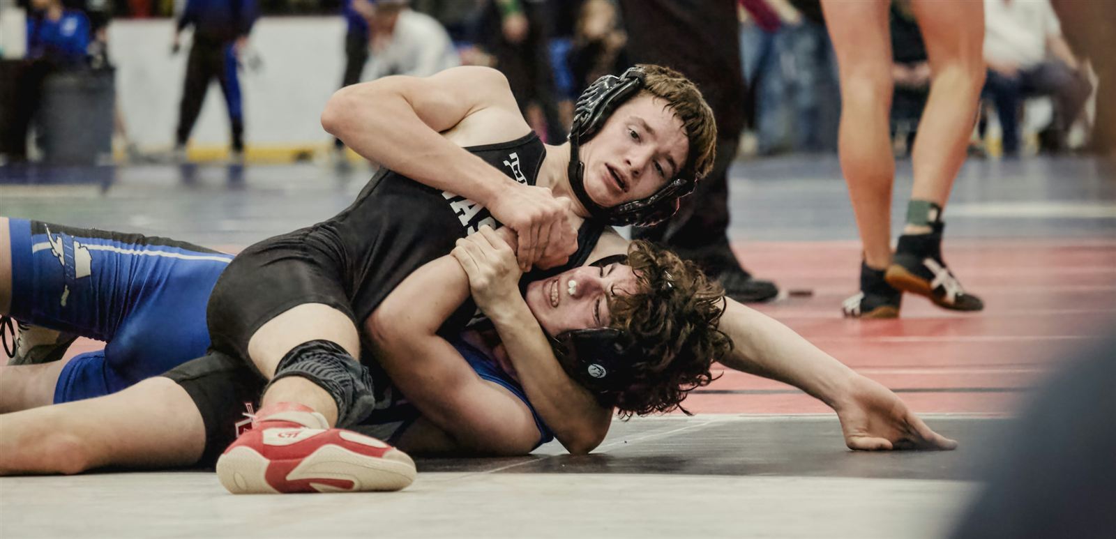 Sparks athletes ages 5–9 on the wrestling mat