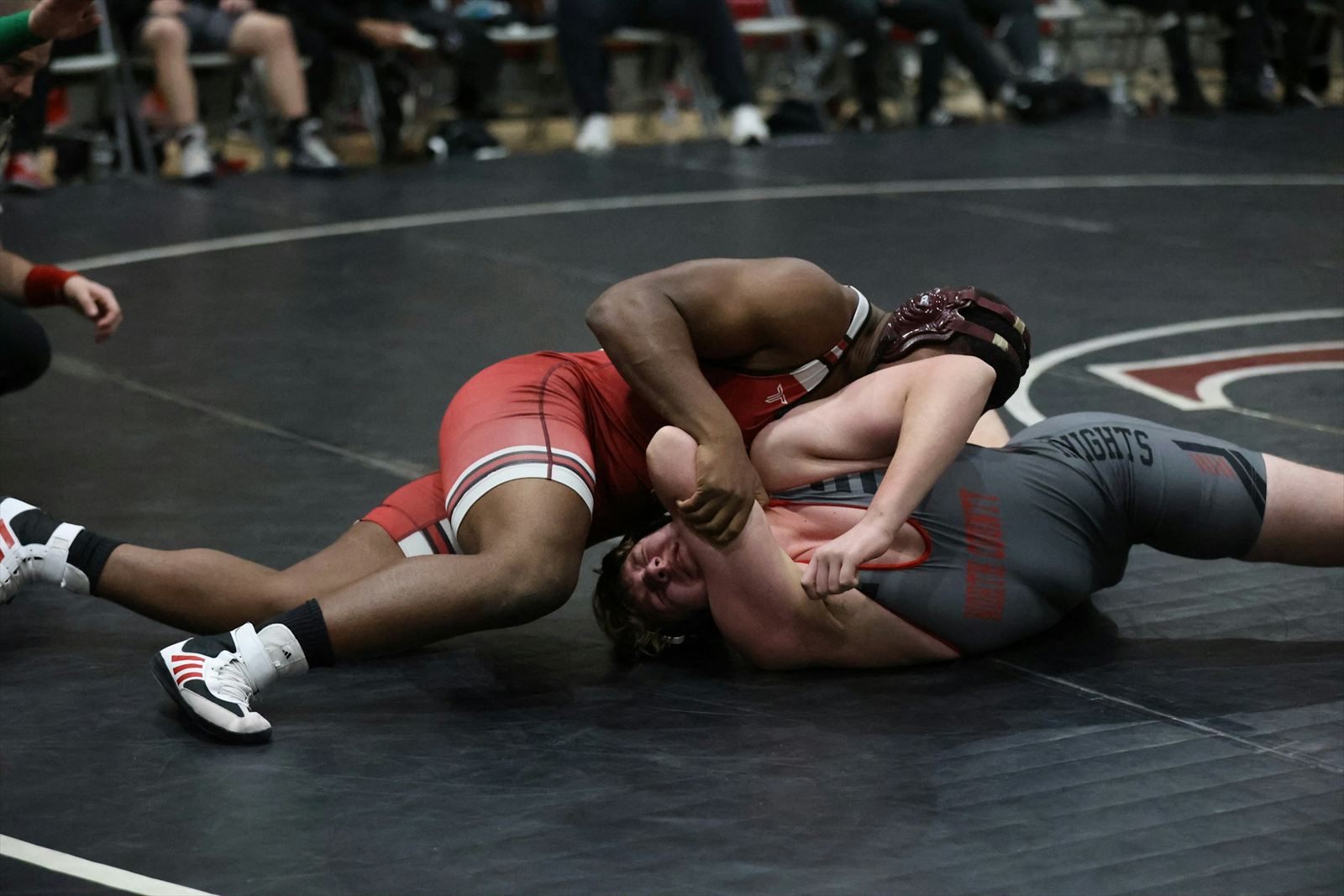 Vanguard athletes ages 15 and older training on the wrestling mat